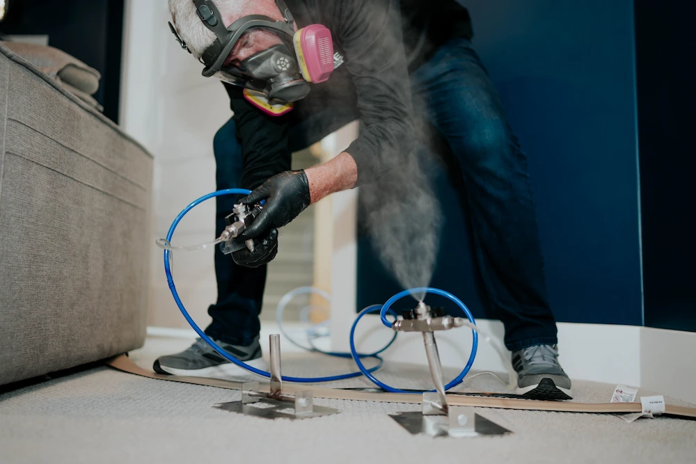 PureAirGA technician performing dry fog mold remediation treatment in a home